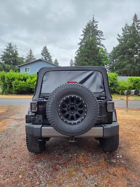 Black 2014 Jeep Wrangler Unlimited Freedom Edition