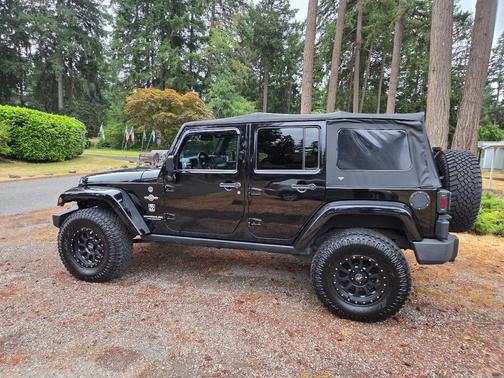Black 2014 Jeep Wrangler Unlimited Freedom Edition