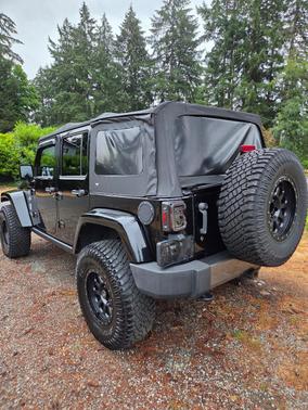 Black 2014 Jeep Wrangler Unlimited Freedom Edition