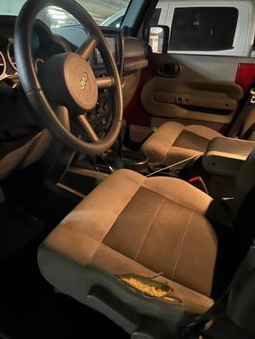 Red 2010 Jeep Wrangler Unlimited Sport