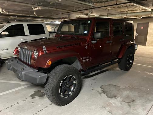 Red 2010 Jeep Wrangler Unlimited Sport
