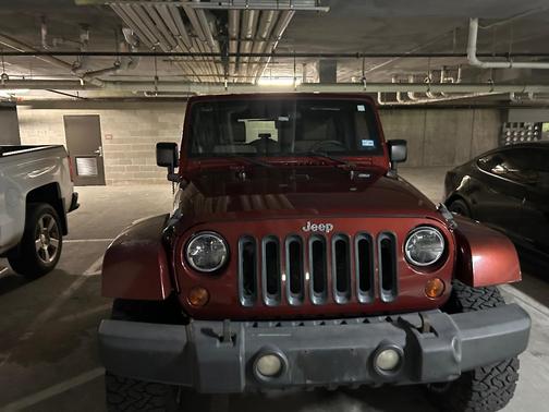 Red 2010 Jeep Wrangler Unlimited Sport