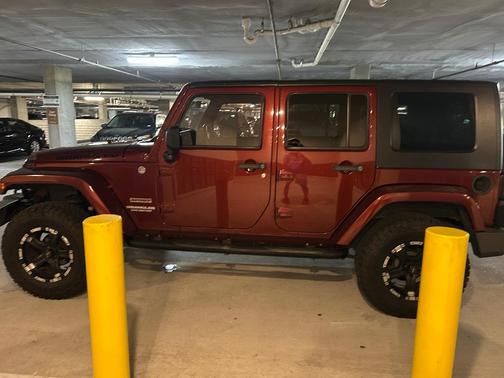 Red 2010 Jeep Wrangler Unlimited Sport