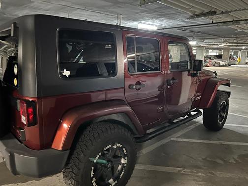 Red 2010 Jeep Wrangler Unlimited Sport