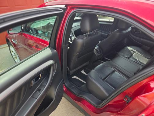 Red 2016 Ford Taurus SEL