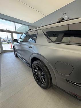 Gray 2026 Cadillac Escalade IQL Premium Sport