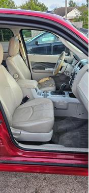 Red 2010 Mercury Mariner Base