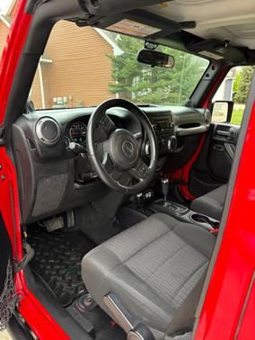 Red 2012 Jeep Wrangler Unlimited Sport