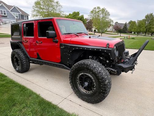 Red 2012 Jeep Wrangler Unlimited Sport