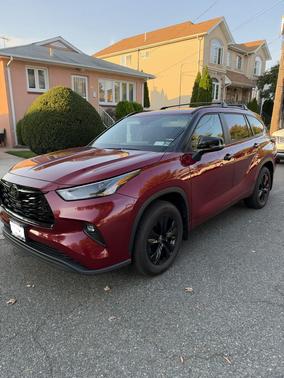 Red 2025 Toyota Highlander Hybrid XLE Nightshade