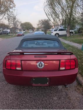 Red 2005 Ford Mustang Deluxe