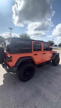 Orange 2023 Jeep Wrangler Sport S
