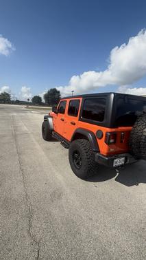 Orange 2023 Jeep Wrangler Sport S