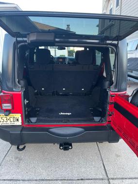 Red 2014 Jeep Wrangler Unlimited Sport