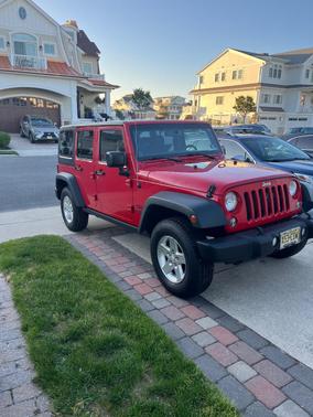 Red 2014 Jeep Wrangler Unlimited Sport
