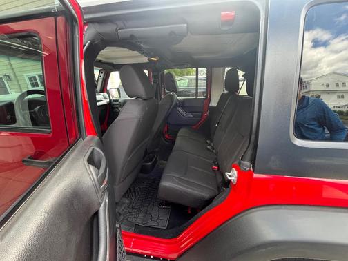 Red 2014 Jeep Wrangler Unlimited Sport