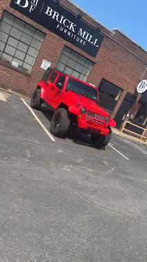 Red 2016 Jeep Wrangler Unlimited Sahara