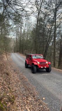 Red 2016 Jeep Wrangler Unlimited Sahara