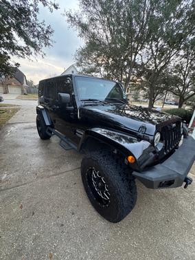 Black 2016 Jeep Wrangler Unlimited Sport