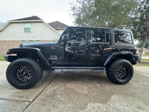Black 2016 Jeep Wrangler Unlimited Sport