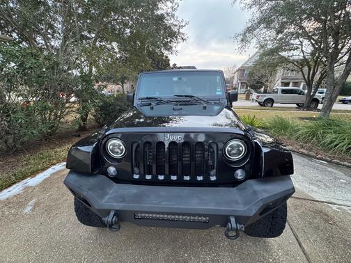 Black 2016 Jeep Wrangler Unlimited Sport