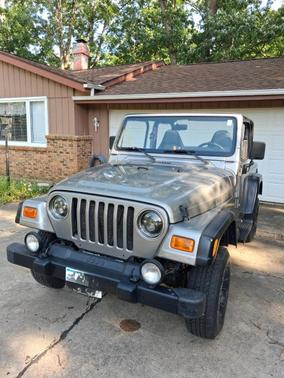Beige 2000 Jeep Wrangler Sport
