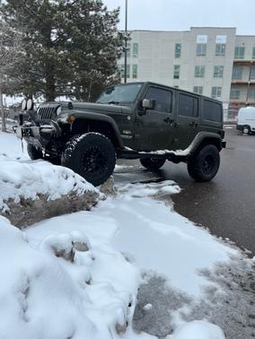 Green 2015 Jeep Wrangler Unlimited Sahara