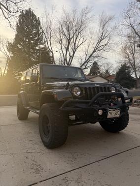Green 2015 Jeep Wrangler Unlimited Sahara