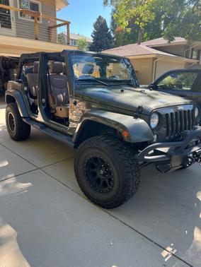 Green 2015 Jeep Wrangler Unlimited Sahara