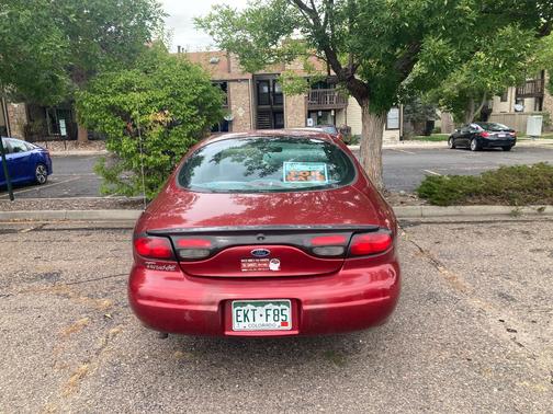 Red 1999 Ford Taurus SE