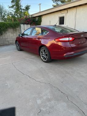 Red 2015 Ford Fusion SE