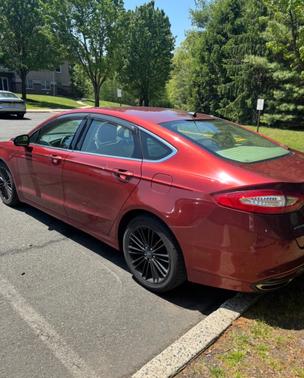Red 2014 Ford Fusion SE