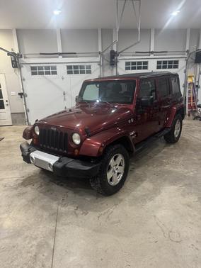 Red 2008 Jeep Wrangler Unlimited Sahara