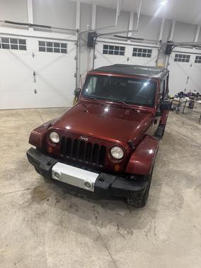 Red 2008 Jeep Wrangler Unlimited Sahara