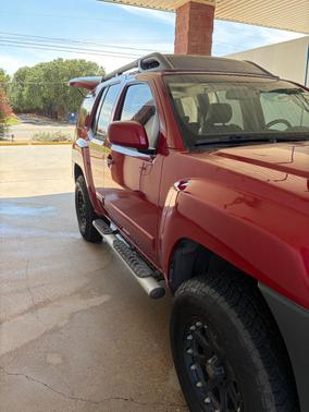 Red 2009 Nissan Xterra SE