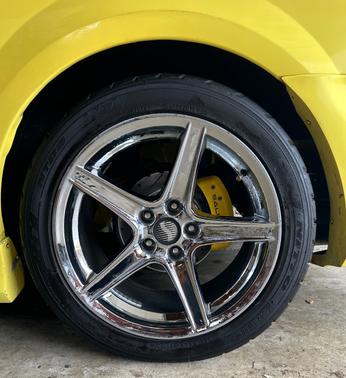 Yellow 2002 Ford Mustang GT