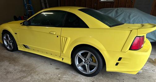 Yellow 2002 Ford Mustang GT