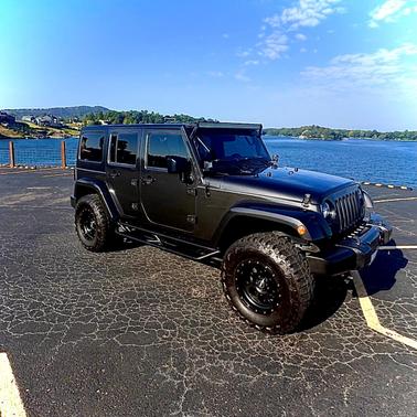 Gray 2016 Jeep Wrangler Unlimited Sahara