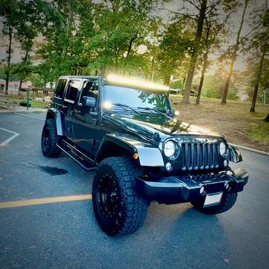 Gray 2016 Jeep Wrangler Unlimited Sahara