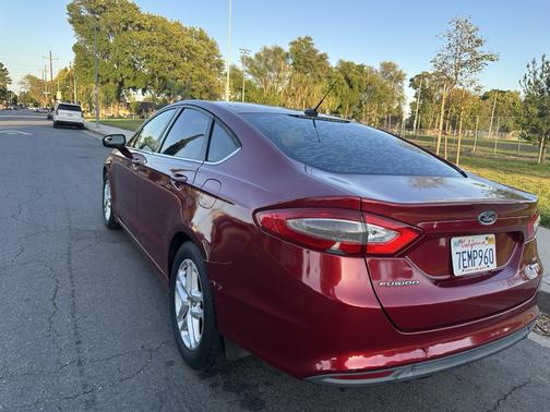 Red 2014 Ford Fusion SE