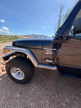 Blue 2000 Jeep Wrangler Sport