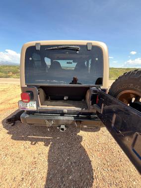 Blue 2000 Jeep Wrangler Sport