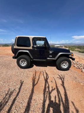Blue 2000 Jeep Wrangler Sport