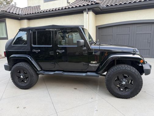 Black 2014 Jeep Wrangler Unlimited Sahara