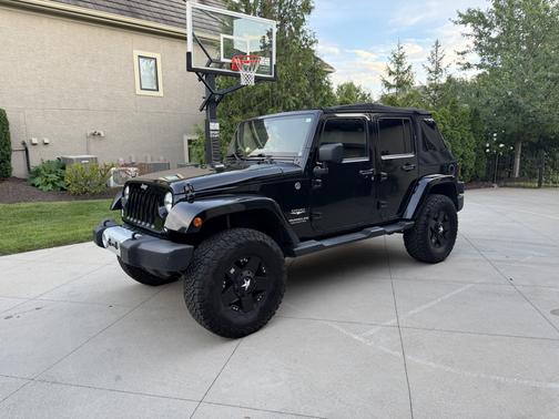 Black 2014 Jeep Wrangler Unlimited Sahara