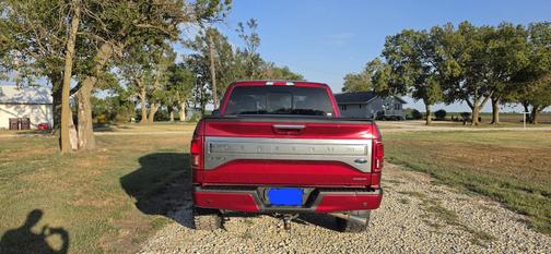 Red 2015 Ford F-150 Platinum