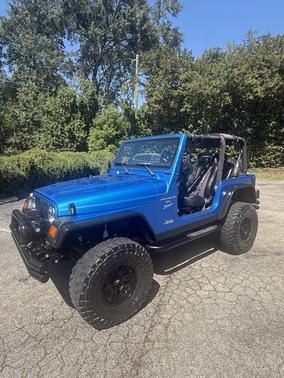 Blue 1999 Jeep Wrangler Sport
