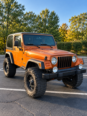 Orange 1999 Jeep Wrangler Sport