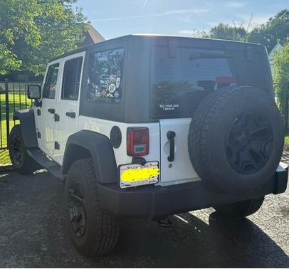 White 2015 Jeep Wrangler Unlimited Sport