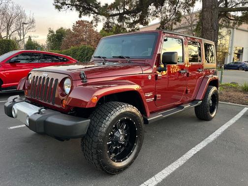 Red 2009 Jeep Wrangler Unlimited Sahara